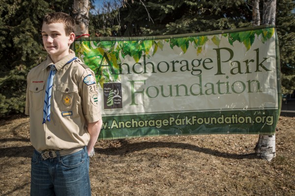 Eagle Scout next to APF banner