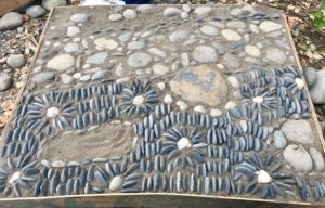 Close-up of decorative stone-work on reflexology path
