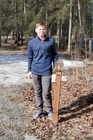 Boy scout with site marker